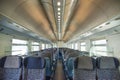 Empty rail passenger carriage seat rows with dimishing perspective Royalty Free Stock Photo