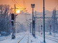 Empty rail roads near train station on a snow covered evening Royalty Free Stock Photo