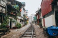 empty railroad between buildings in Hanoi, Vietnam