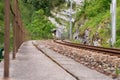 Empty railroad tracks leading into a dark tunnel Royalty Free Stock Photo