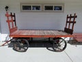 Empty railway wooden cart with four wheels. Royalty Free Stock Photo