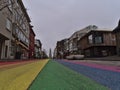 Empty rainbow road in Reykjavik downtown, dedicated to the Reykjavik Pride Gay Festival, with HallgrÃÂ­mskirkja church in winter. Royalty Free Stock Photo