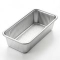 Empty Rectangular Aluminum Loaf Pan with Ribbed Sides on White Background baking pan cake pan Royalty Free Stock Photo