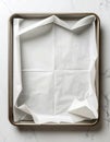 Empty Rectangular Baking Sheet with White Parchment Paper Overhead Shot Royalty Free Stock Photo