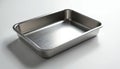Empty rectangular stainless steel baking tray sits on a clean white surface, perfect for culinary needs. This versatile kitchen Royalty Free Stock Photo