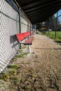 Empty red baseball dugout bench Royalty Free Stock Photo