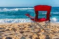 A red beach chair facing the water on Sunset Beach, Hawaii Royalty Free Stock Photo