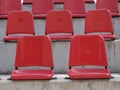 Empty red bleacher seats