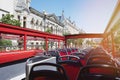 Empty red bus seats with open roof Royalty Free Stock Photo