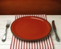 Empty red ceramic plate