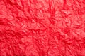 Empty red crumpled silk paper background, lot of copy space. Royalty Free Stock Photo