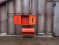 Empty red fire safety cabinet with the open door Royalty Free Stock Photo