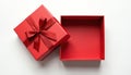 Empty red gift box with ribbon bow open top view on white backdrop. Simple clean surface for product placement or promotion. Royalty Free Stock Photo