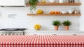 Empty Red Gingham Table with Blurred Modern Kitchen Background Royalty Free Stock Photo