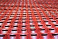 Empty red plastic seats are in hall Royalty Free Stock Photo