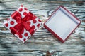 Empty red present box on vintage wooden board Royalty Free Stock Photo