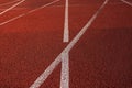 Empty red running track at the stadium with markup