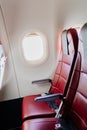 empty red seats for passengers in the cabin of the aircraft. Economy class. Royalty Free Stock Photo