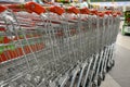 Grocery baskets are at the entrance to the store. Empty baskets in a row, supermarket interior. Royalty Free Stock Photo