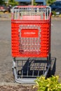 Empty red shopping cart with name Value Village a Savers brand