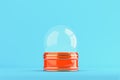 Empty snow globe on bright blue background Royalty Free Stock Photo