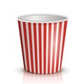 An empty red-and-white striped bucket of popcorn. Royalty Free Stock Photo