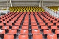 Empty red and yellow seats in stadium. Royalty Free Stock Photo