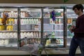 Empty refrigerated shelves at Publix featuring dairy food shortage including milk, yogurt, and sour cream, during Covid-19 corona