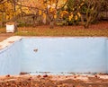 Empty swimming pool with dry leaves on bottom Royalty Free Stock Photo