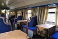 Empty restaurant with blue seats in train Royalty Free Stock Photo