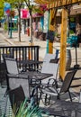 Empty restaurant summer terrace with tables and chairs. Cafe on the pedestrian street waiting for customers Royalty Free Stock Photo