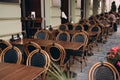 Empty restaurant summer terrace with tables and chairs. Reastaurant tables waiting for customers at an outdoor terrace Royalty Free Stock Photo