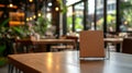 Empty Menu Card Holder on Table in Cozy Restaurant Out of Focus Bokeh Background Royalty Free Stock Photo