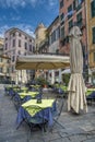 Empty restaurant tables and umbrellas