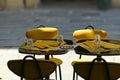 Empty restaurant terrace table yellow seats on sidewalk