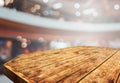 Empty retro wood table top with blurred restaurant kitchen design