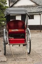 Empty rickshaw parked on street