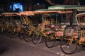 Empty typical chinese rickshaws on night street of Macau Royalty Free Stock Photo