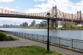 Queensbridge Park along the East River with the Queensboro Bridge and a Street Light during Spring in Long Island City Queens New Royalty Free Stock Photo