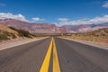 An empty road in Argentina leading towards the border with Chile in the Andes mountain range. Royalty Free Stock Photo