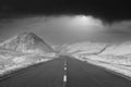 Empty road blank horizon dramatic winter snow at sides in Scottish highlands at Glencoe Rannoch Moor in Black and white Buachaille Royalty Free Stock Photo