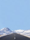 Empty road blank horizon snow at sides in Scottish highlands at Glencoe Rannoch Moor Buachaille Etive Mor Mountain Scotland center Royalty Free Stock Photo