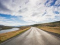 Empty road with a blue cloudy sky, Iceland Royalty Free Stock Photo