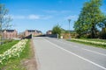 empty road and bridge, beautiful blossoming daffodils and historical architecture