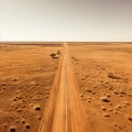 An empty road is captured from a top-down perspective, offering an aerial view of the great landscape it traverses