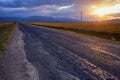 Empty road, clouds and sunset Royalty Free Stock Photo