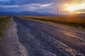 Empty road, clouds and sunset Royalty Free Stock Photo