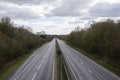 An empty road during the Coronavirus lockdown. The dual carriageway is usually very busy but today its devoid of vehicles Royalty Free Stock Photo