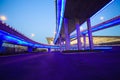 Empty road floor with city viaduct bridge of neon lights night