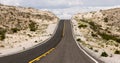 Empty road going up a hill on a desert in Nevada Royalty Free Stock Photo